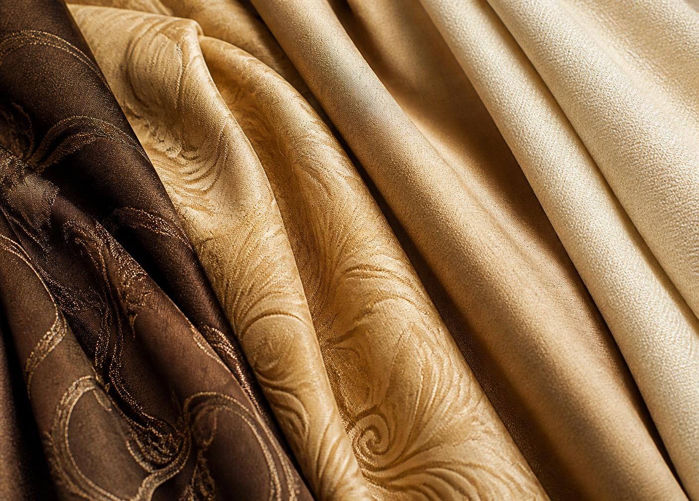 Premium curtain fabric swatches in gold and beige tones